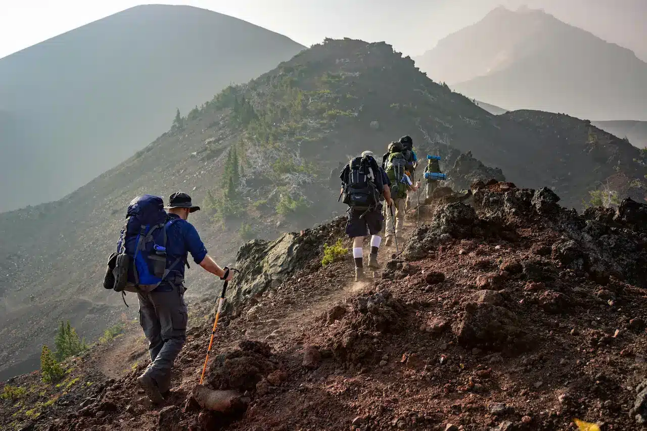 A Group Of People Hiking In Mountains
